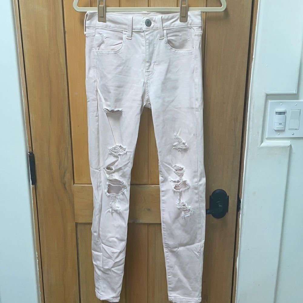 Baby pink American eagle jeans with rips size 4